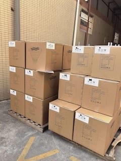SCL-001 and SCL-001M solar street light cartons palletized for shipment
