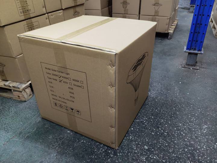 Real shipment image — SCL-002Plus solar garden-light carton prepared in warehouse staging