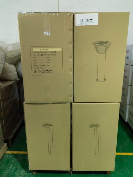 Real shipment image — SLL-001/80 solar bollard-light cartons staged with matching pole cartons