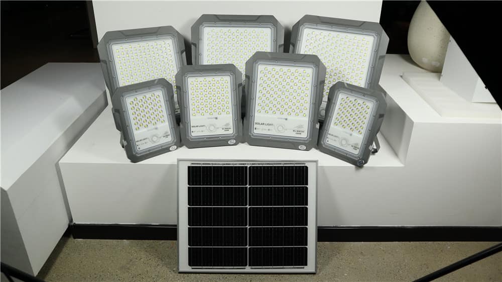 Solar flood light samples arranged beside a separate solar panel
