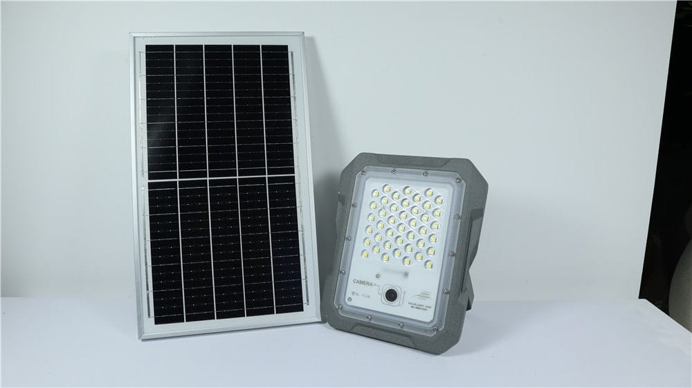 Camera-equipped solar flood light displayed beside its panel