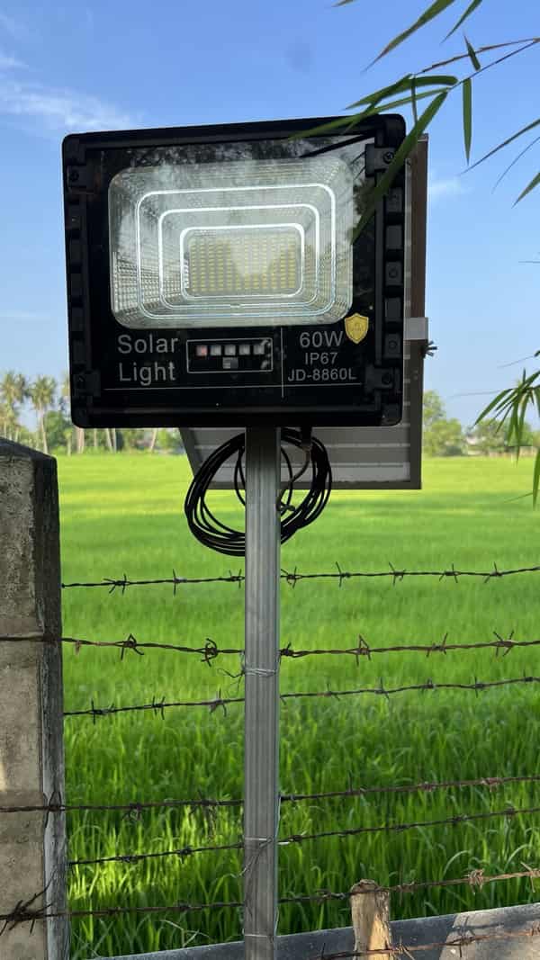 JD flood light installed outdoors in daylight