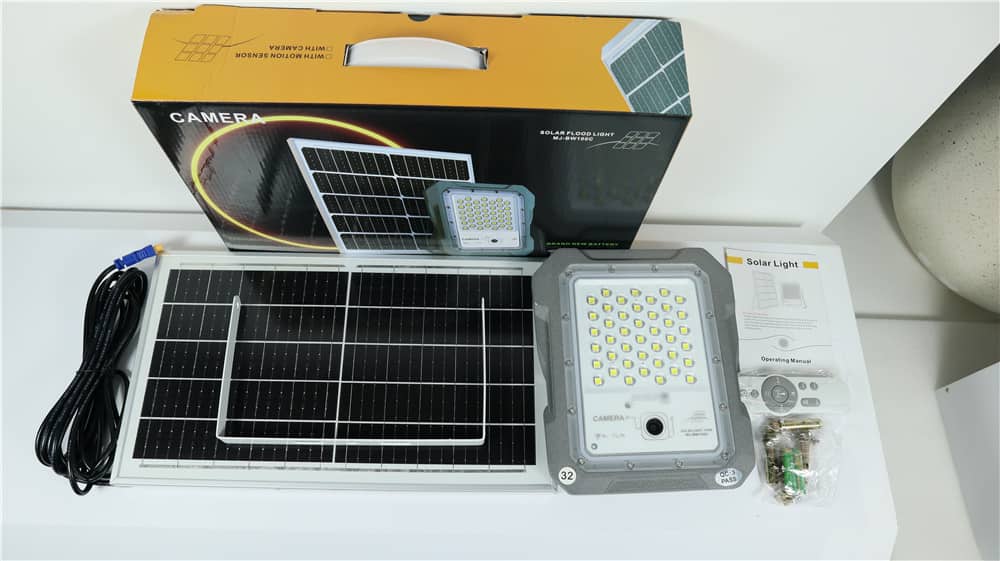 Camera flood light solar panel cable and accessories displayed with packaging