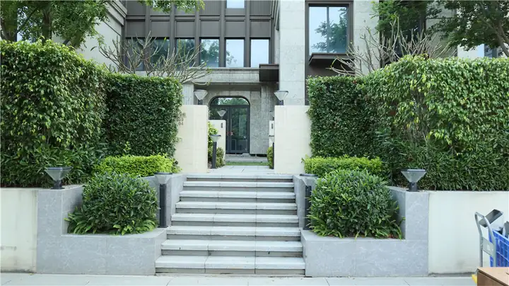 Garden lights around steps leading to a residential entrance
