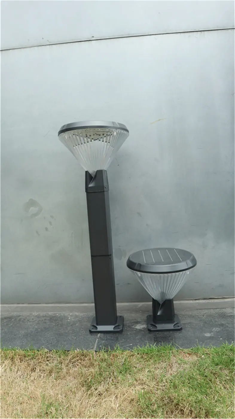 Tall and short landscape light forms beside a wall