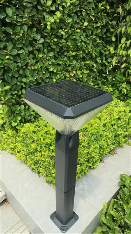 Solar panel integrated into the top of a square garden bollard