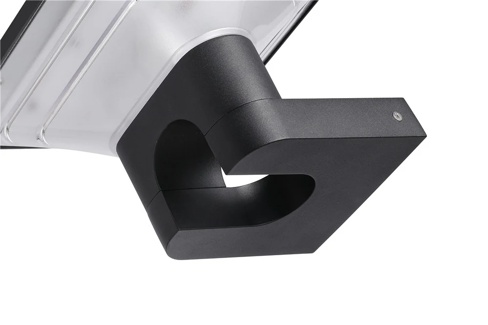 Close view of a wall-light bracket, housing joint and visible fastener