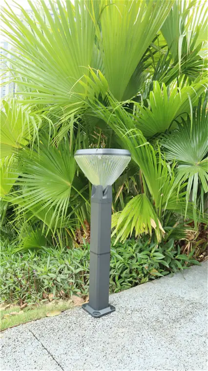 Landscape bollard near dense planting