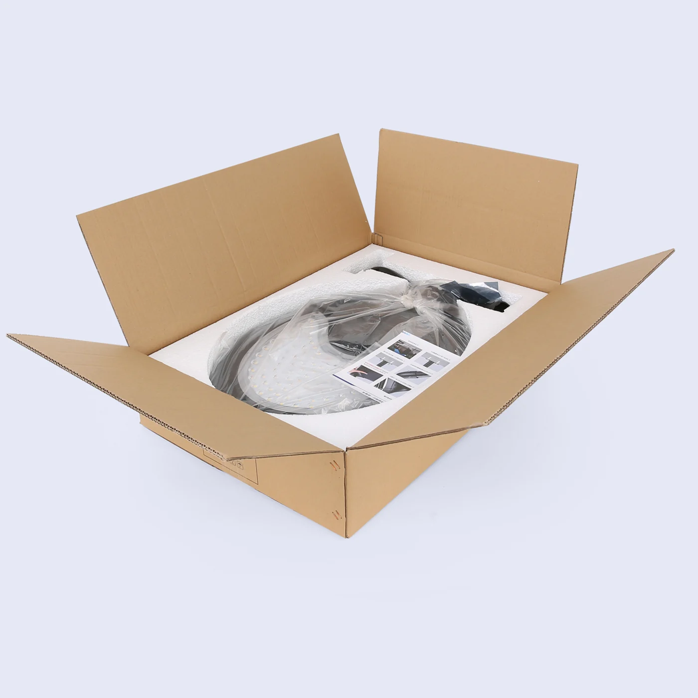 Luminaire presented in an open protective carton