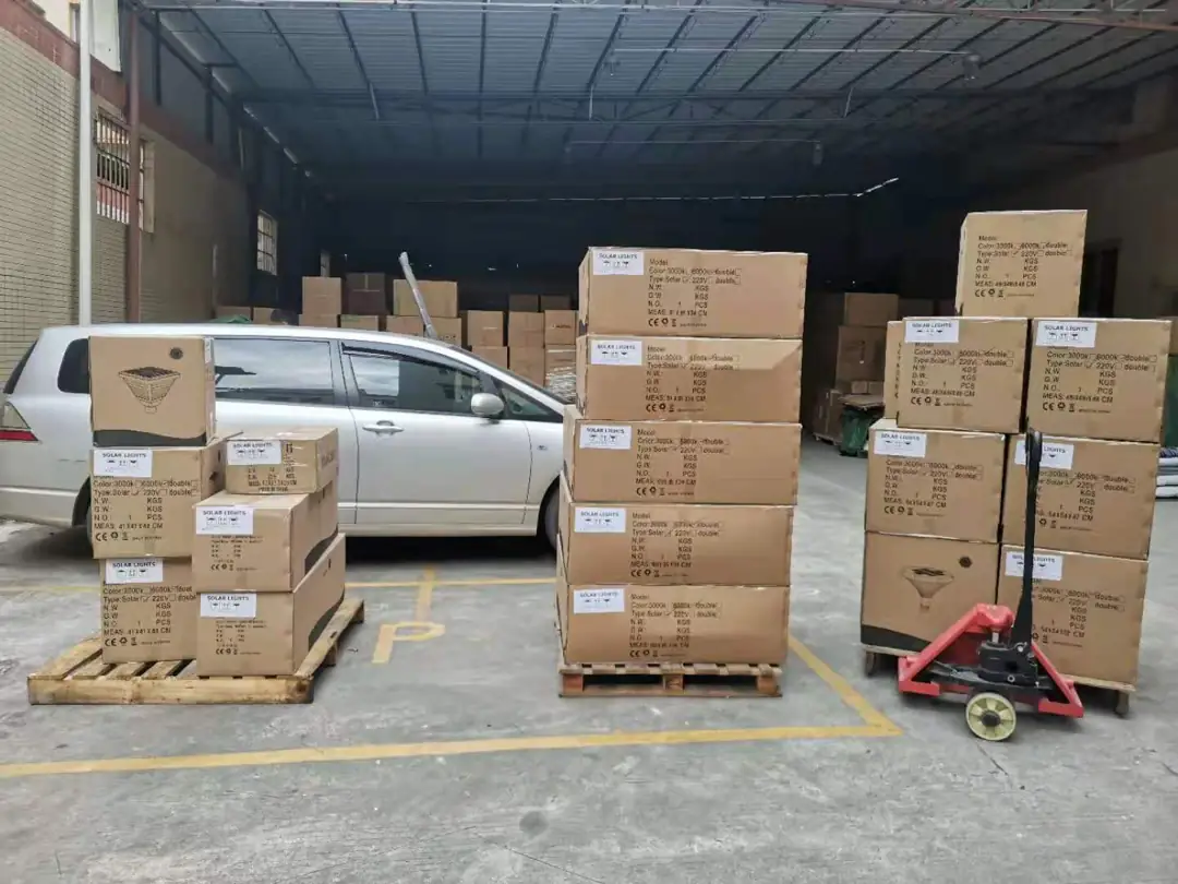 Cartons outside a warehouse near a vehicle