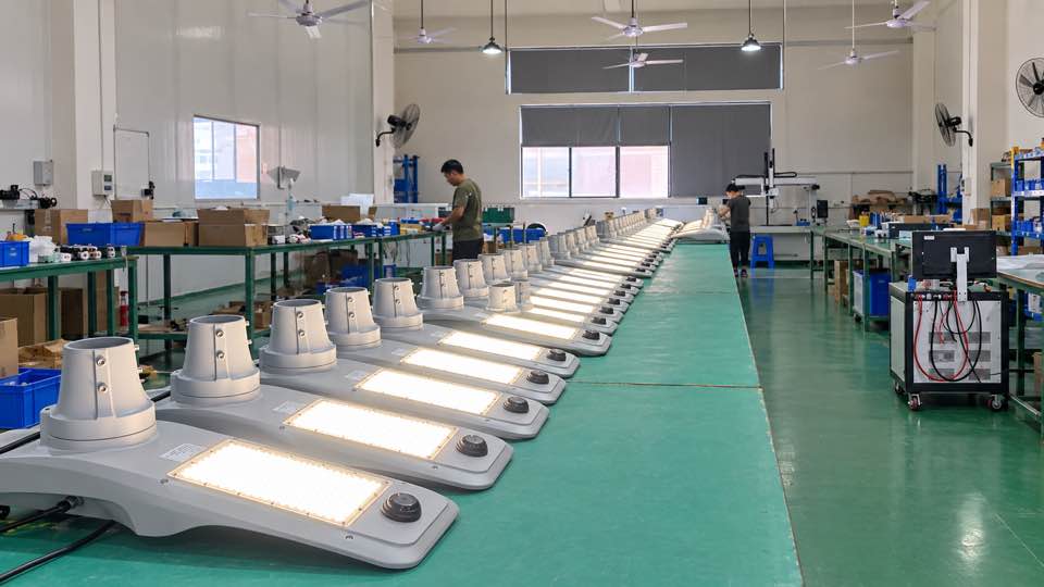 Solar powered street lamp luminaires illuminated during factory quality checking