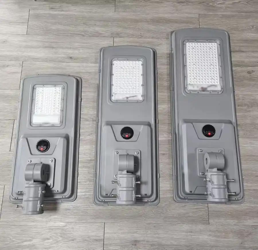 Three QH01 solar street light sizes photographed together
