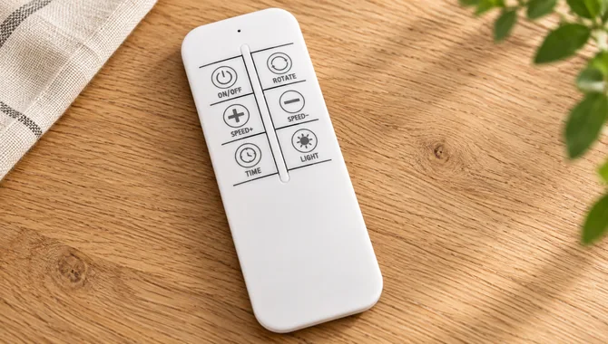 T919 remote control with power, rotation, speed, timer and light buttons on an oak tabletop
